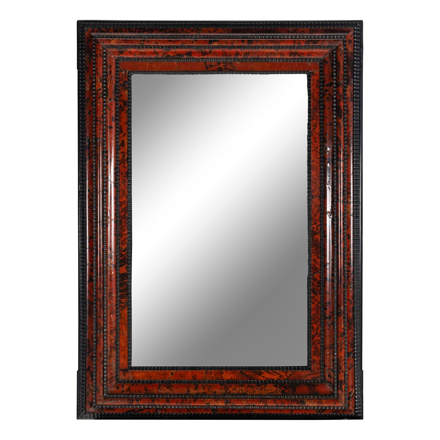 A Flemish Part-Ebonized and Tortoiseshell Veneered Ripple-Molded Mirror
