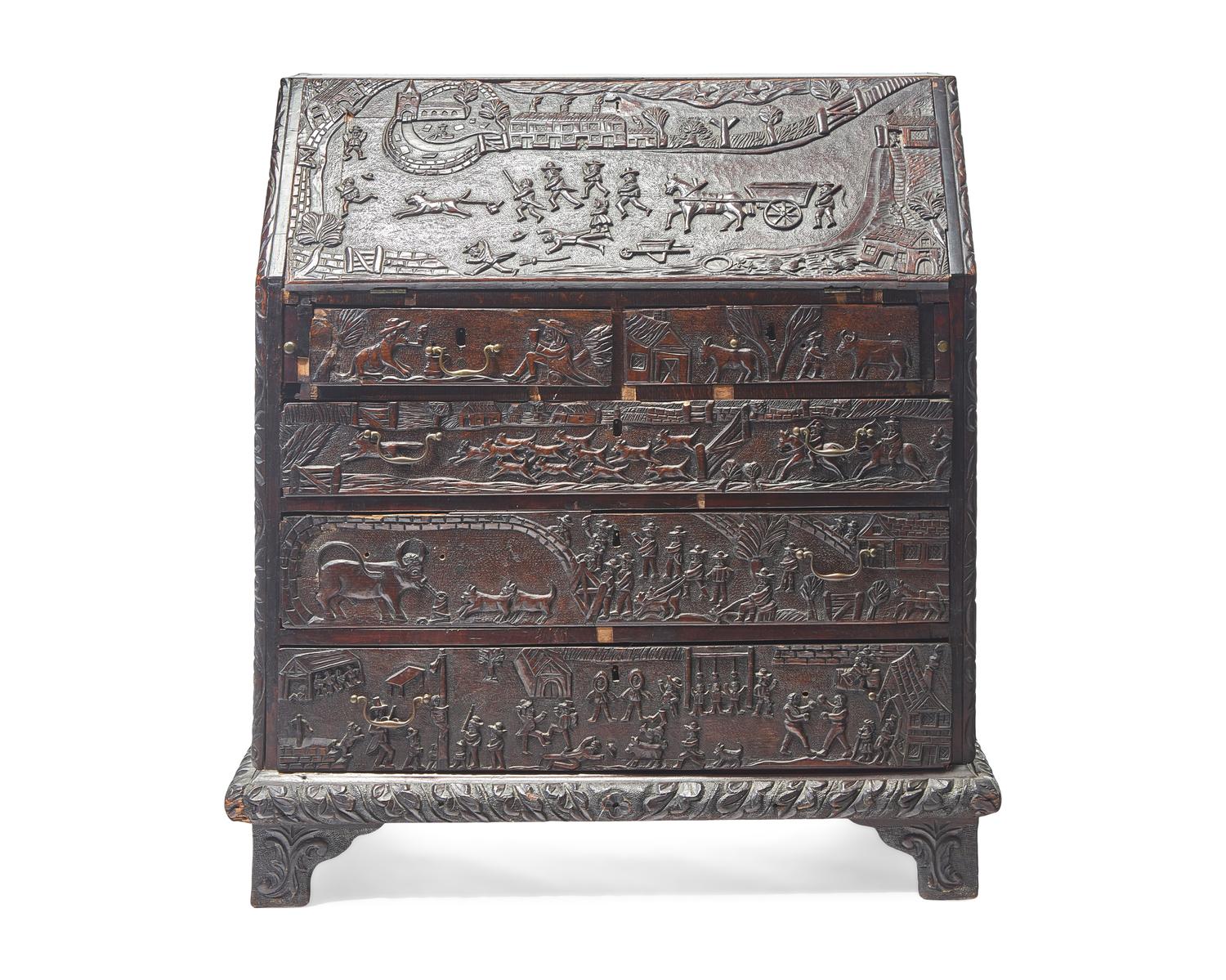 An English Relief-Carved Oak Slant-Front Desk