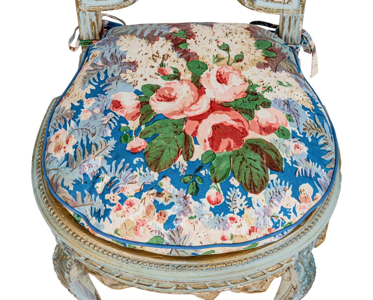 A Pair of Louis XVI Style Painted and Parcel-Gilt Chaises