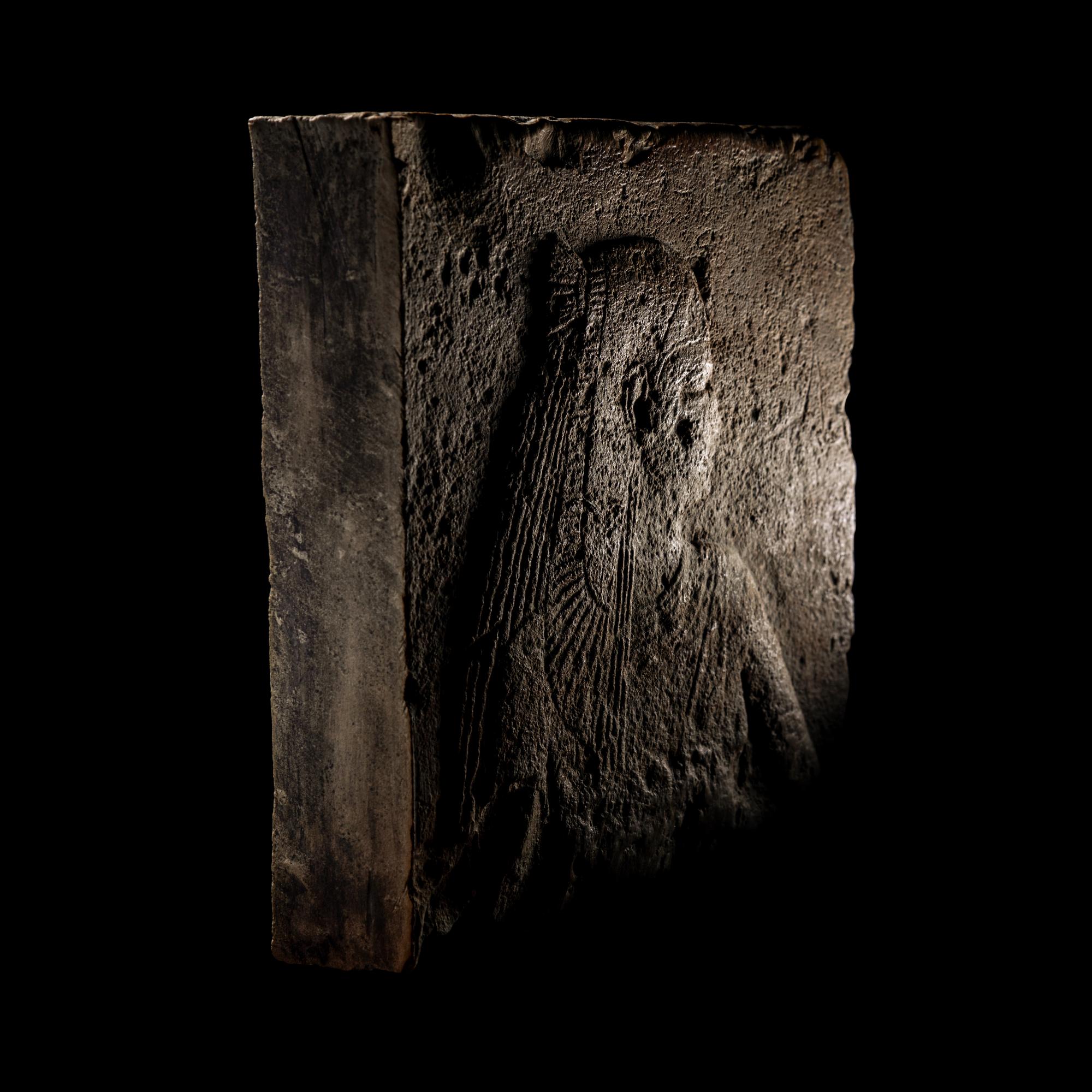 An Egyptian Stone Relief Fragment of a Female Pharaoh or Goddess