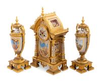 A French Gilt Bronze and Painted Porcelain Clock Garniture