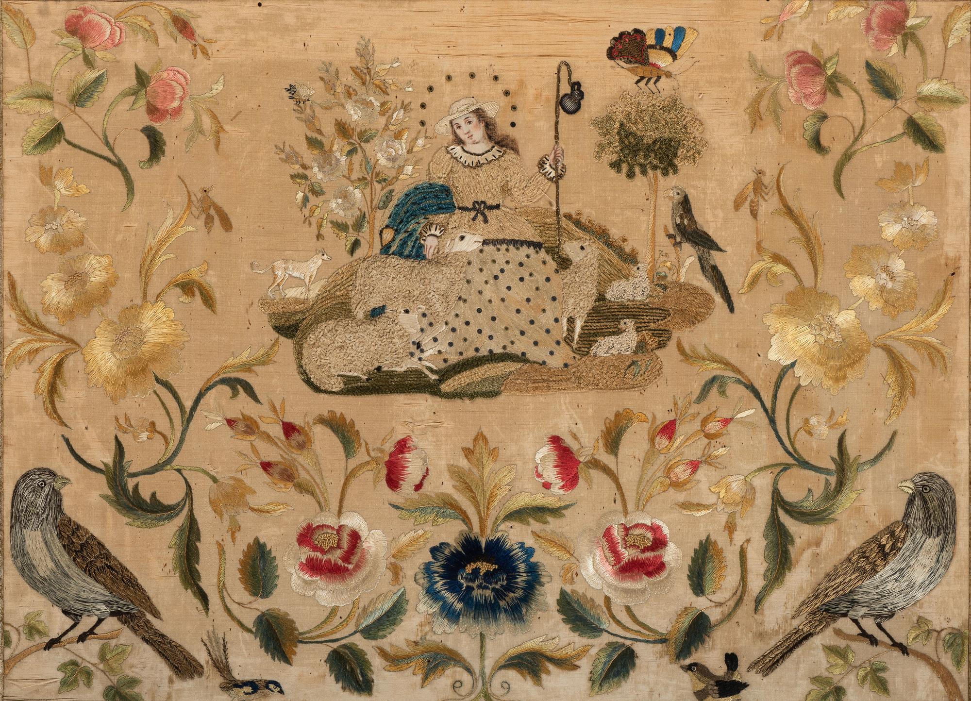 A Needlework Embroidered Picture of a Shepherdess with Flock