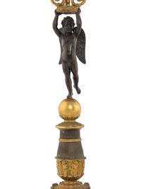A Pair of Empire Style Gilt and Patinated Bronze Figural Candelabra