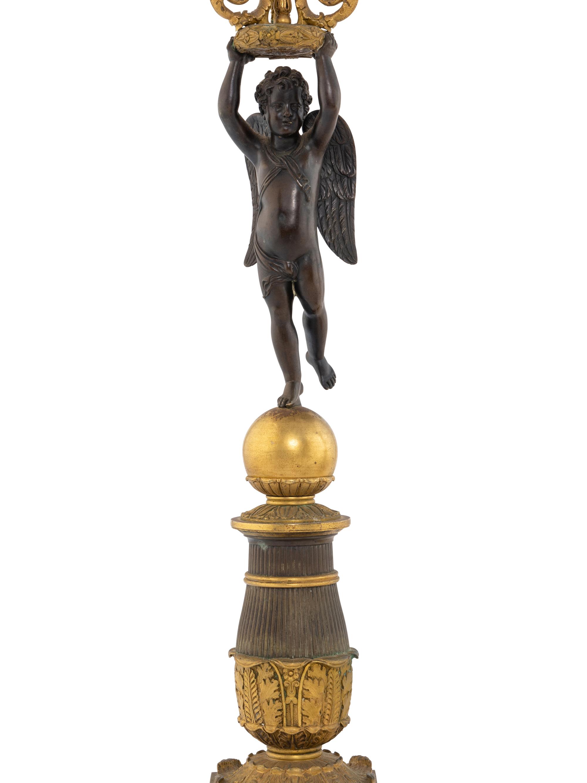 A Pair of Empire Style Gilt and Patinated Bronze Figural Candelabra