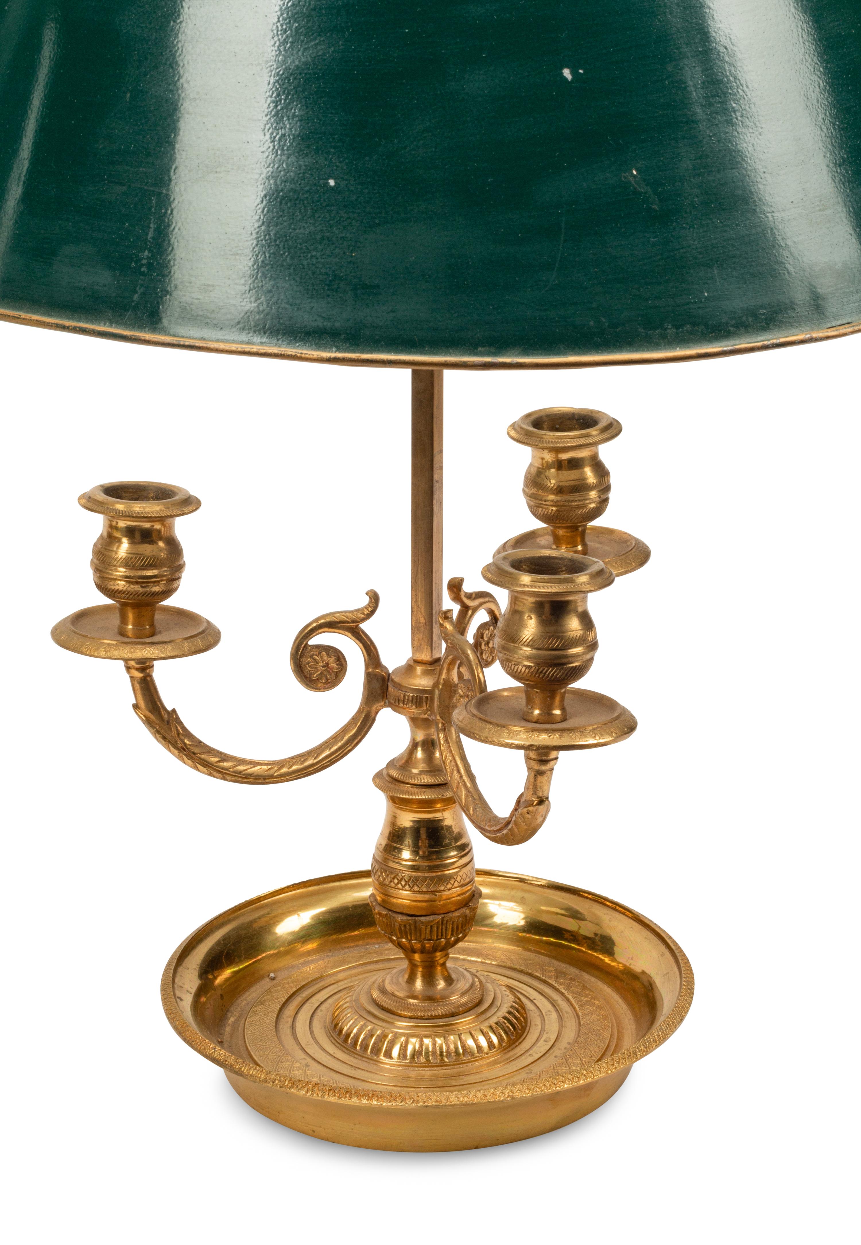 A Pair of Brass Bouillotte Lamps with Tole Shades