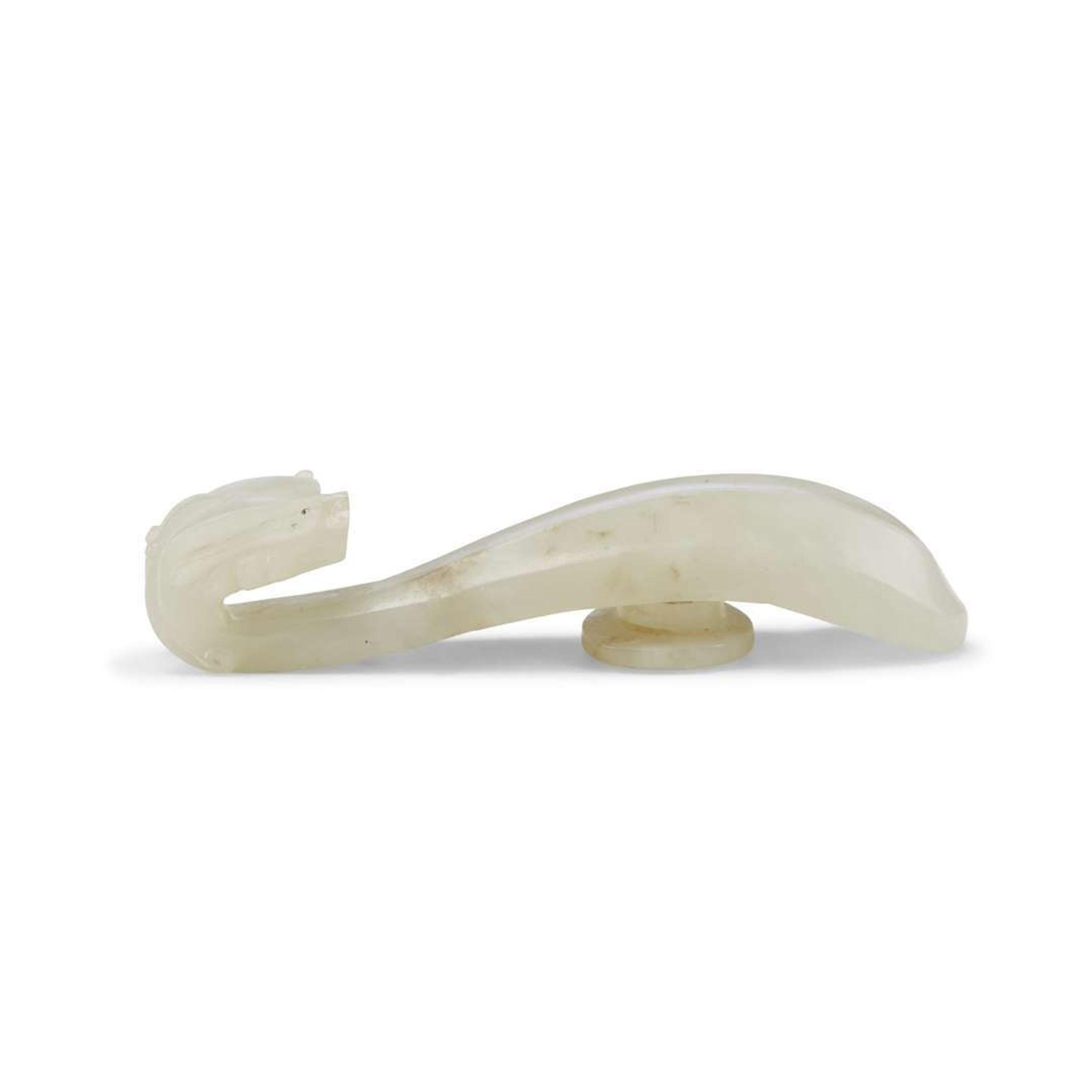 Four Chinese Greyish White Jade "Dragon" Head Belt Hooks, Qing Dynasty — 清 灰白玉龍鉤四件