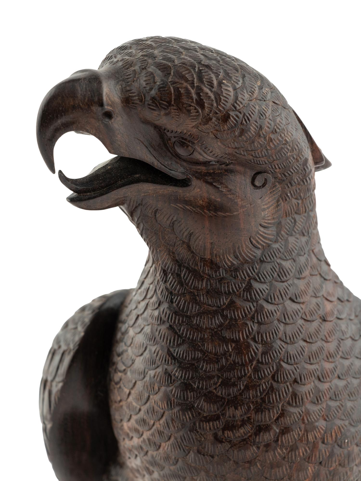 A Japanese Style Carved Rosewood Hawk with Chicks