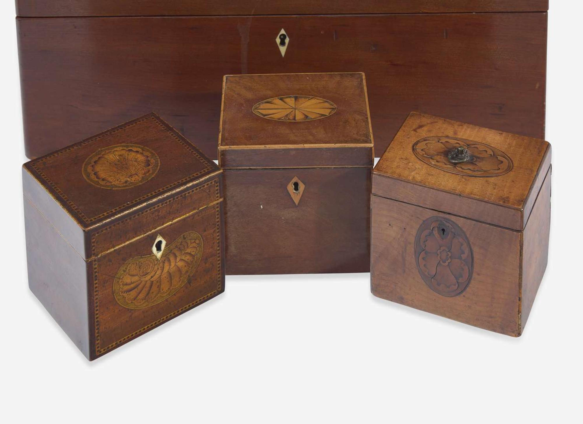A collection of five George III and Regency inlaid mahogany and satinwood tea caddies and one writing box, late 18th / early 19th century