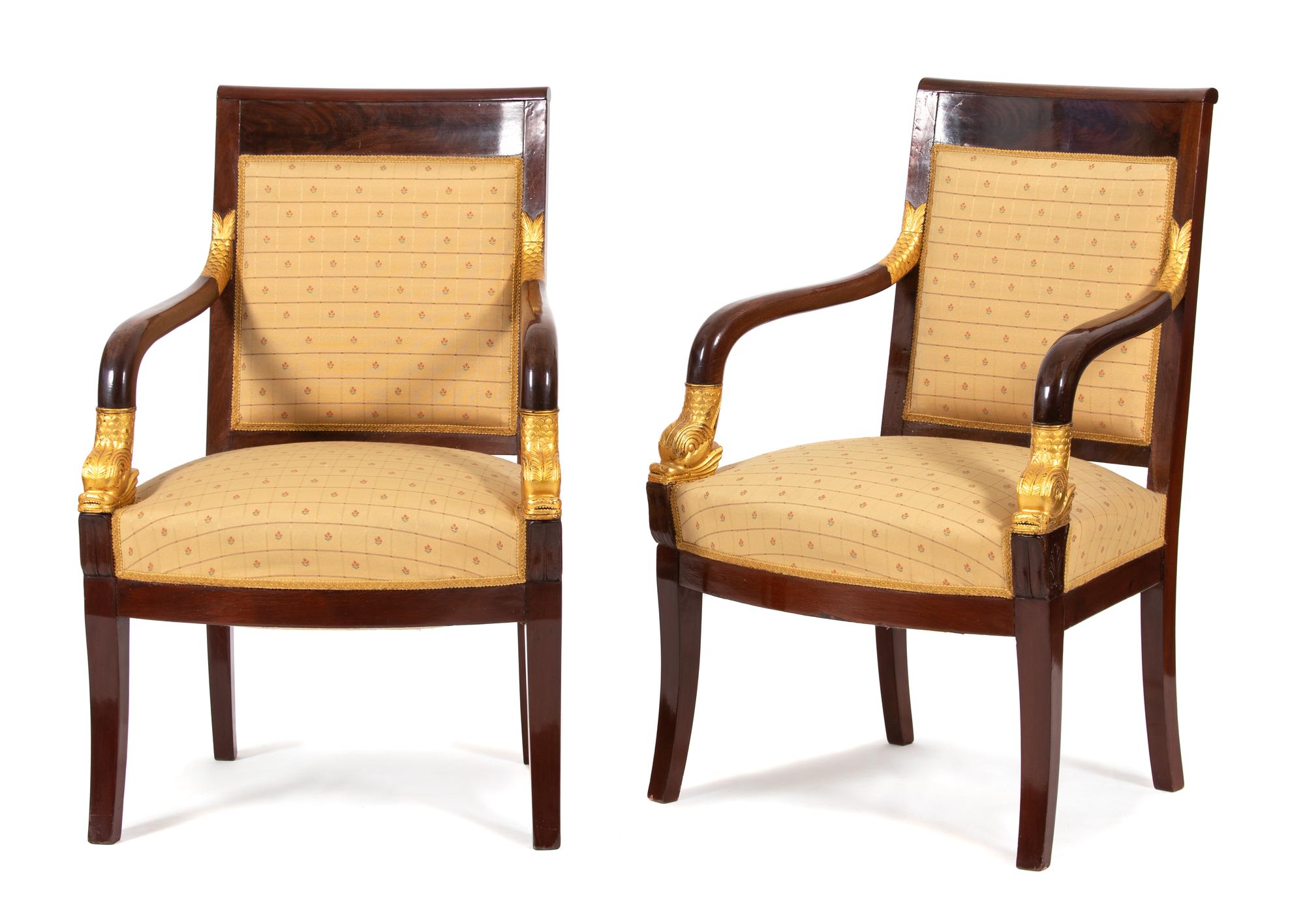 A Pair of French Empire Style Mahogany and Parcel Gilt Armchairs