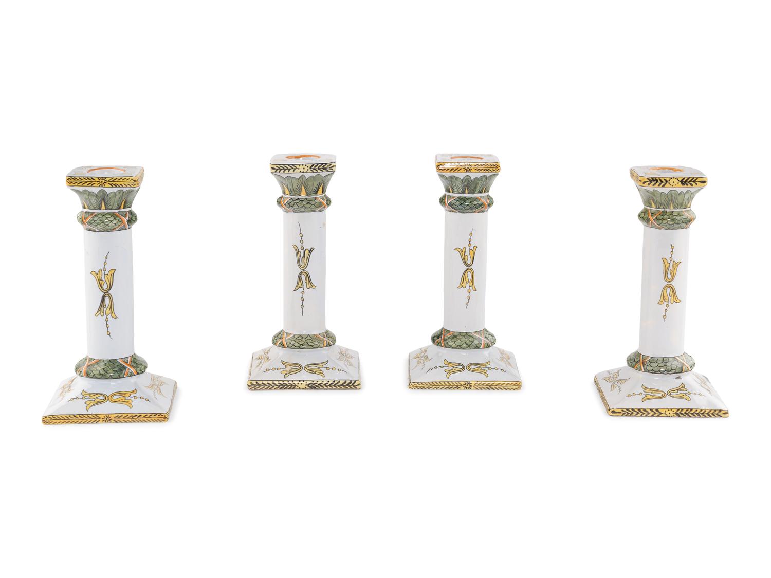 A Set of Four French Faience Candlesticks