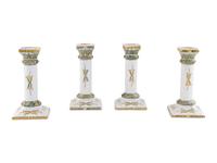 A Set of Four French Faience Candlesticks
