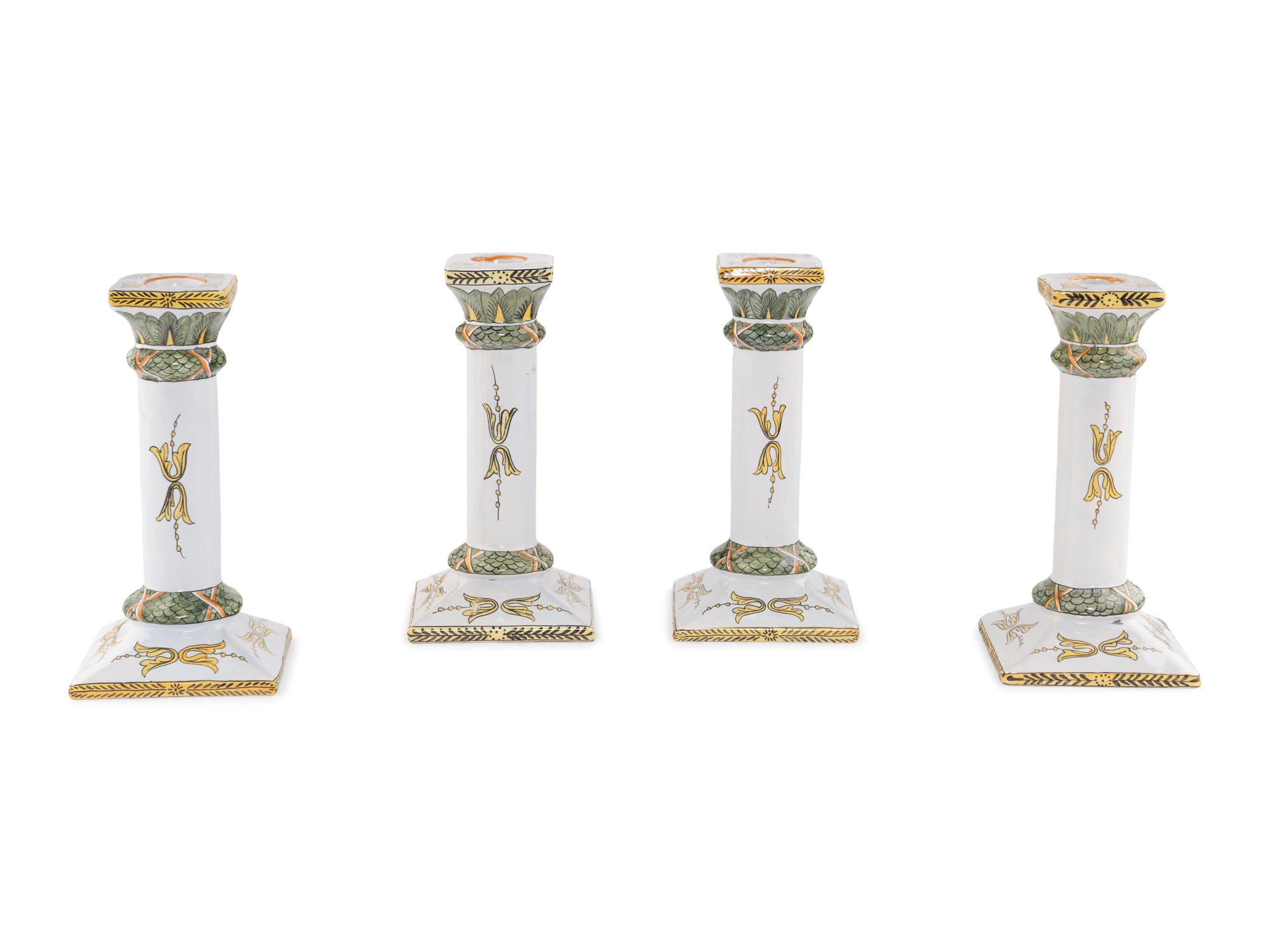 A Set of Four French Faience Candlesticks