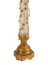 A Louis XV Style Gilt Bronze, Porcelain and Cut Glass Clock Garniture