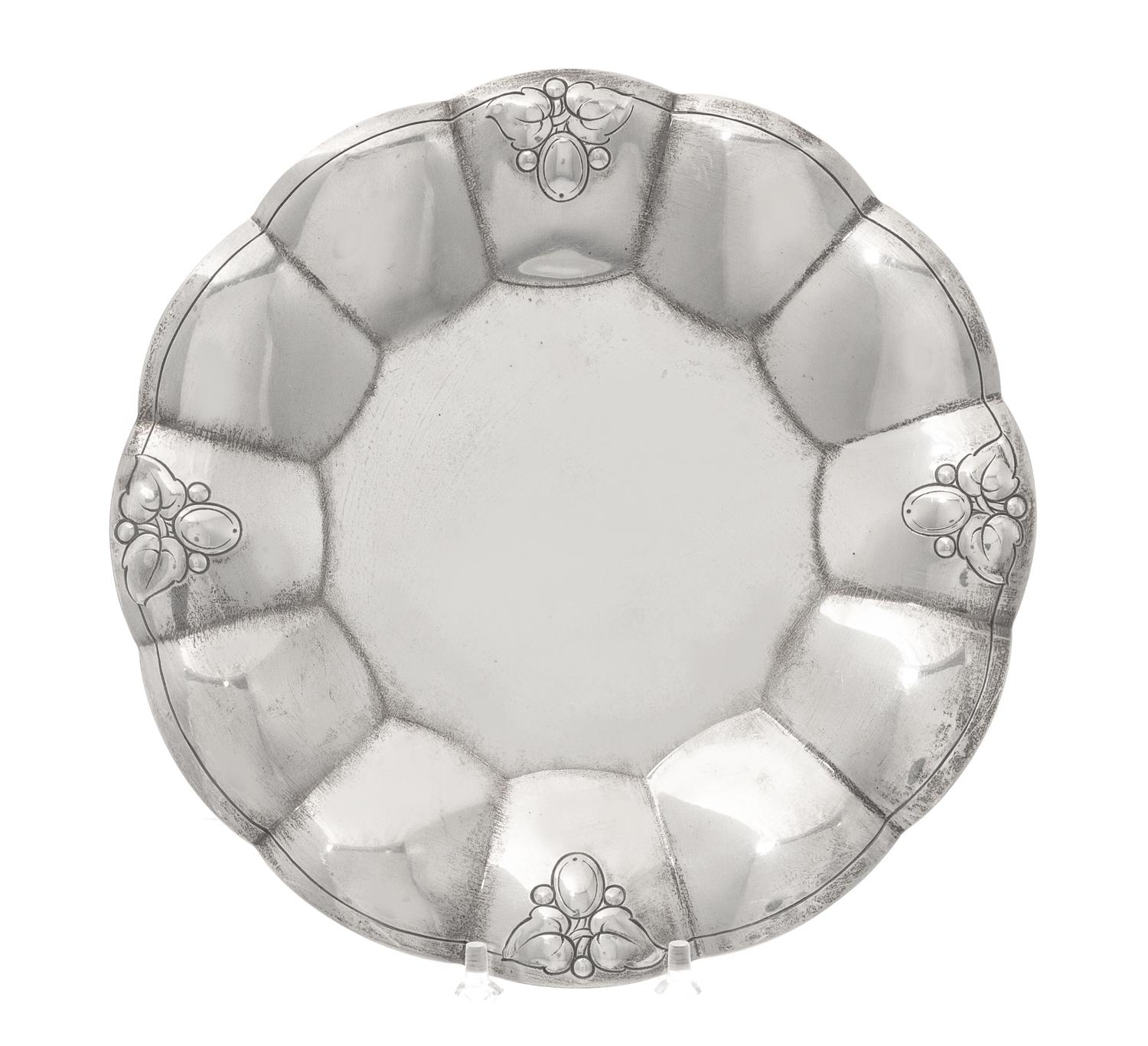 An American Silver Dish, Tiffany & Co., New York, NY, First half 20th century, having scalloped edges with foliate and berry engraving.