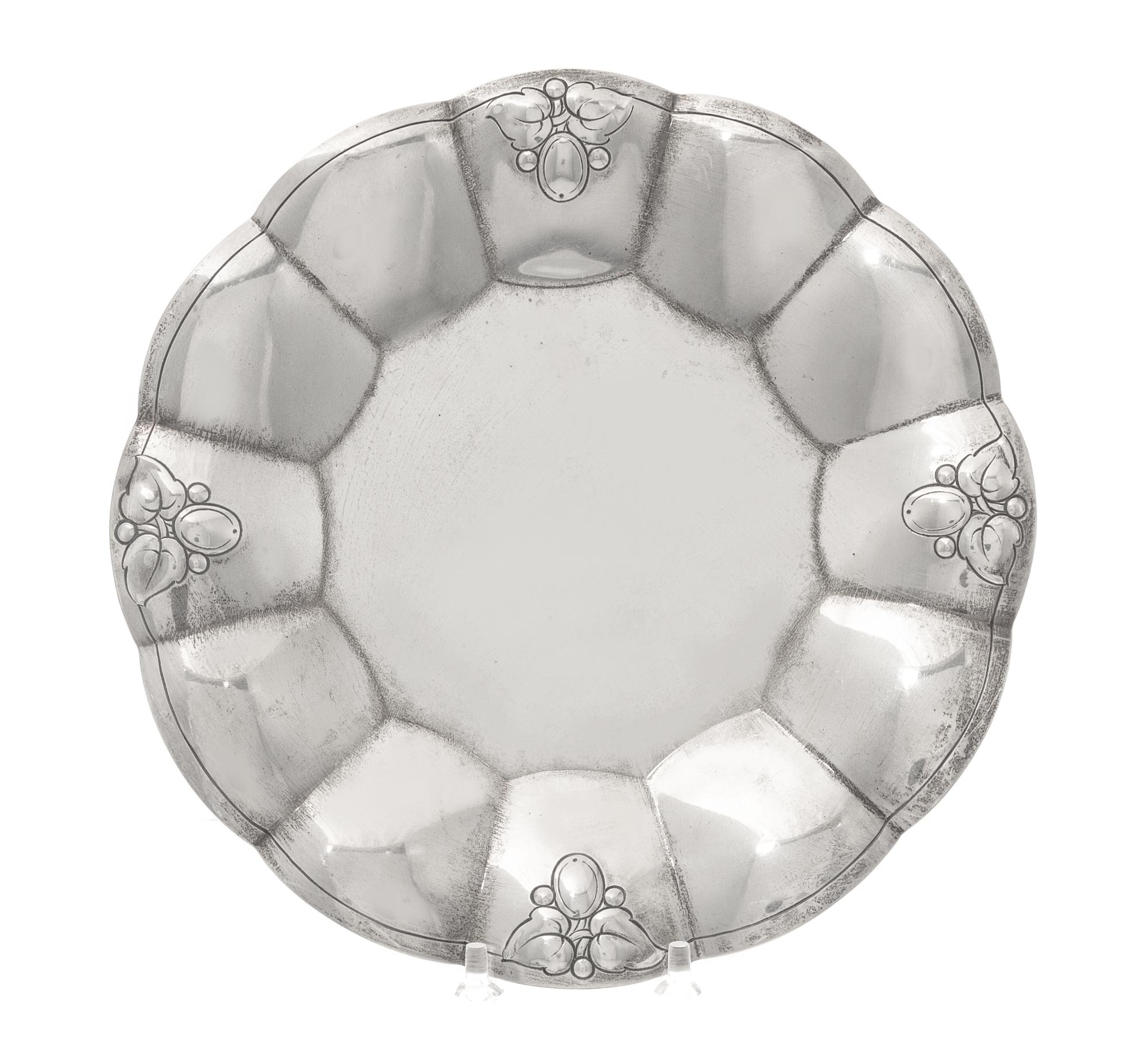 An American Silver Dish, Tiffany & Co., New York, NY, First half 20th century, having scalloped edges with foliate and berry engraving.