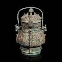 A Chinese archaistic bronze covered ritual wine vessel, You 青銅提梁卣