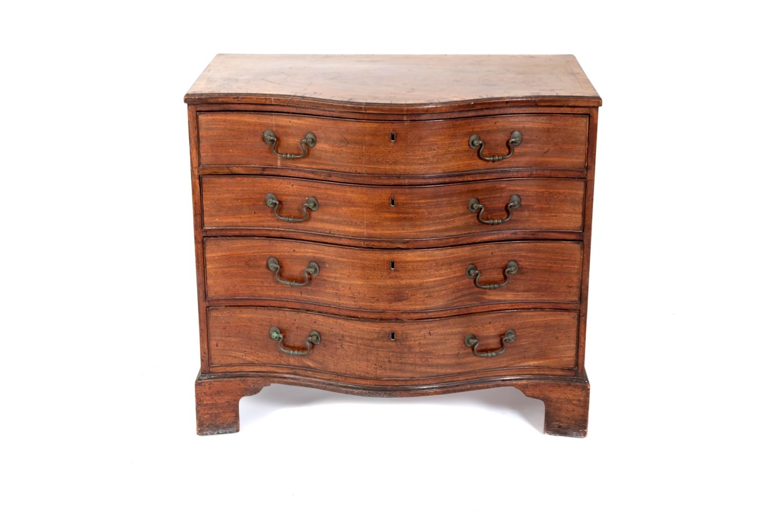 An English Serpentine Chest — 19TH CENTURY