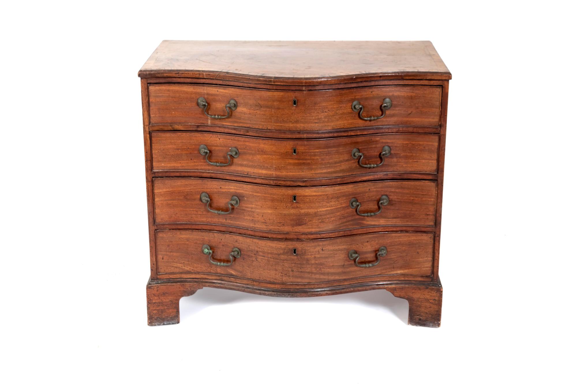 An English Serpentine Chest — 19TH CENTURY