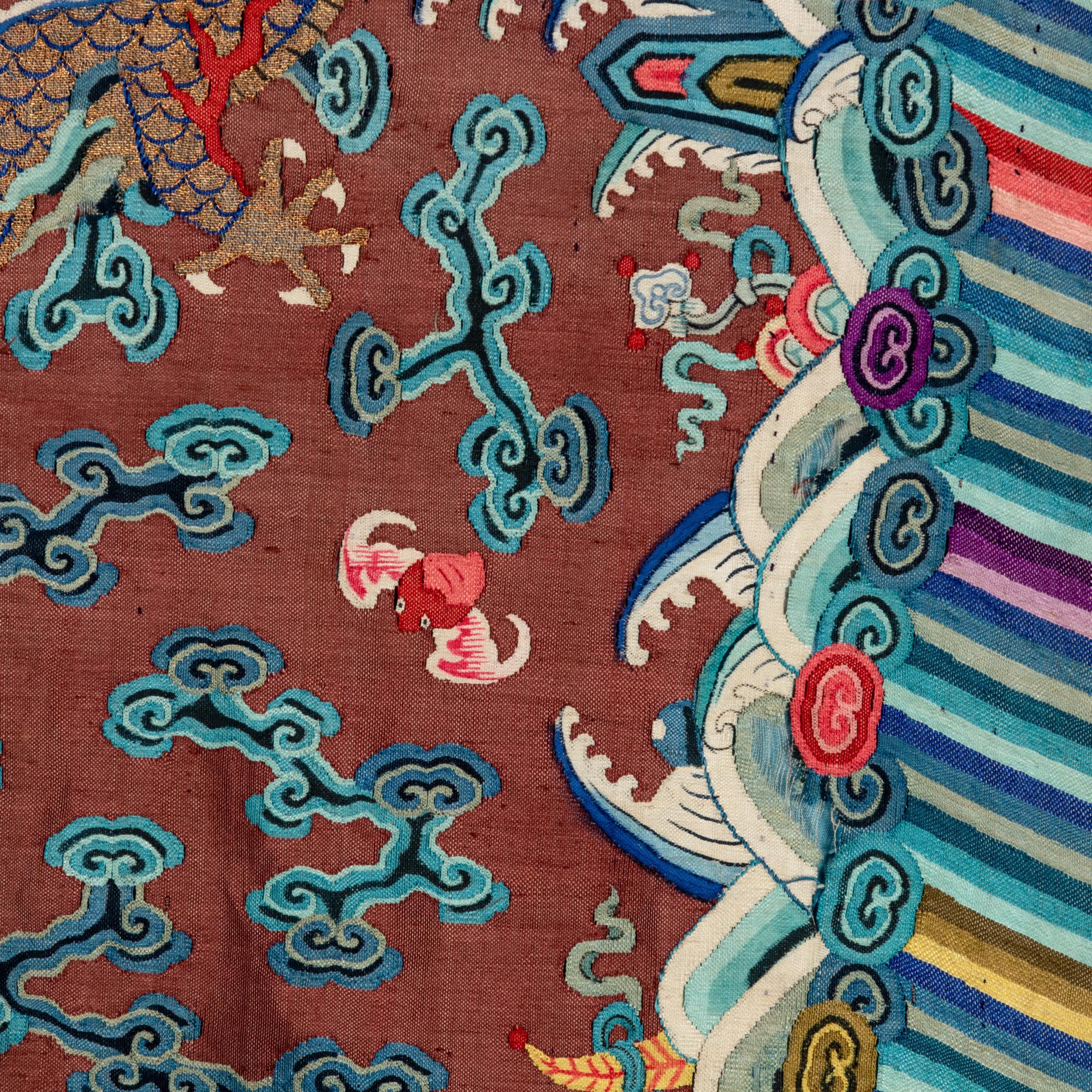 A Chinese Brown Ground Kesi Silk 'Dragon' Robe, Jifu, 19th Century 清晚期 醬地緙絲雲龍紋吉服