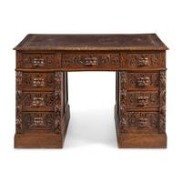 A Renaissance Revival Carved Oak Pedestal Desk