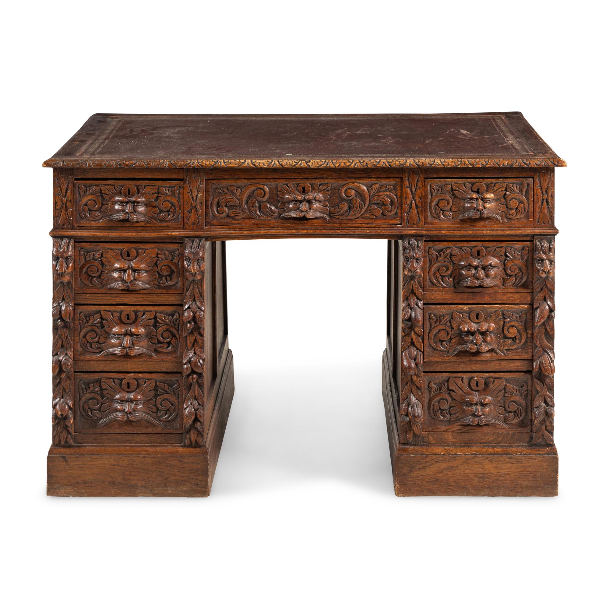 A Renaissance Revival Carved Oak Pedestal Desk