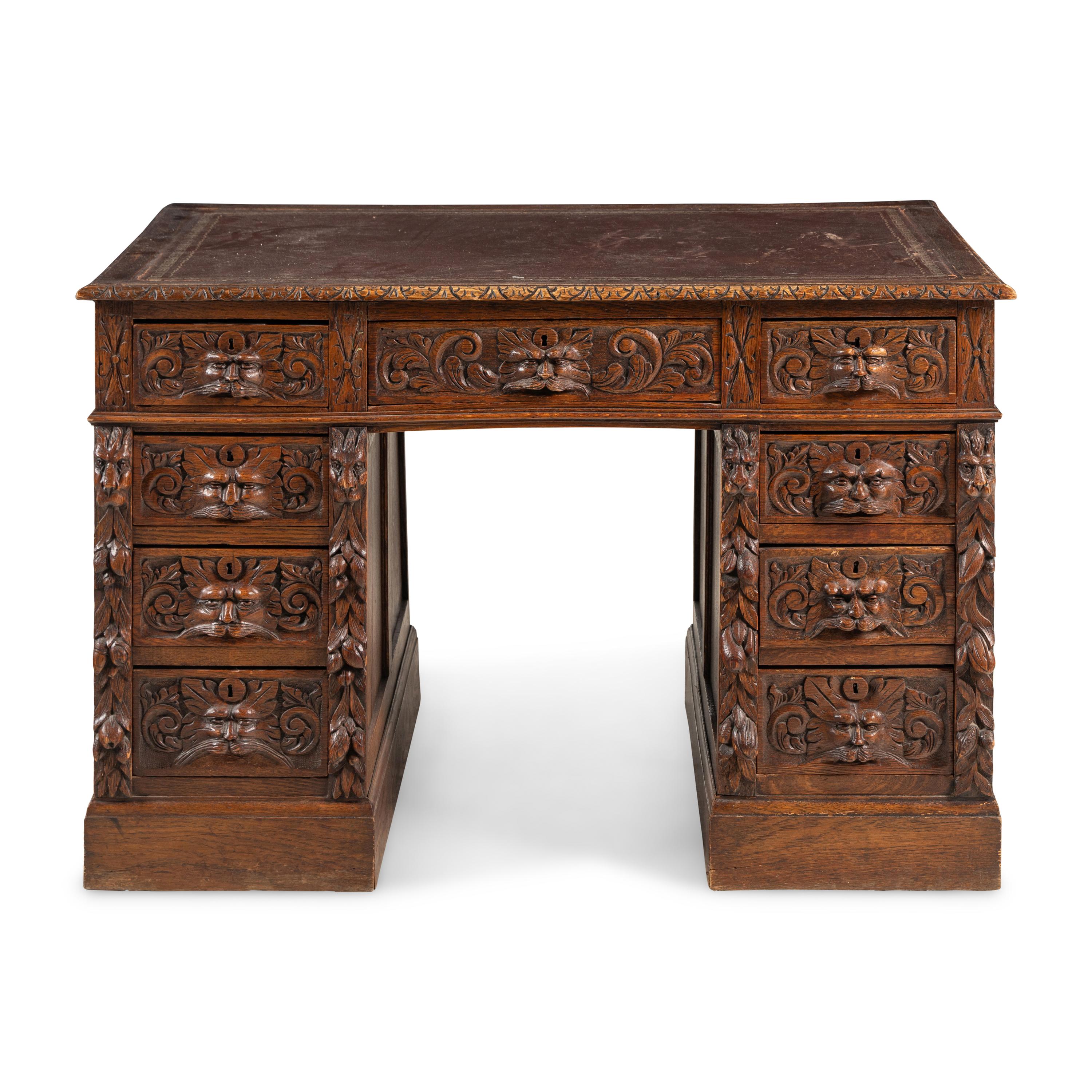 A Renaissance Revival Carved Oak Pedestal Desk