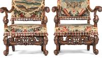 A Pair of William and Mary Style Walnut Armchairs with Flemish Tapestry Upholstery
