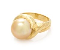 An 18 Karat Yellow Gold and Cultured Golden South Sea Pearl Ring, Henry Dunay, 11.90 dwts.