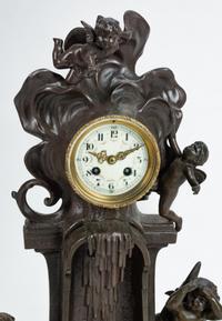 A French Patinated Bronze and Marble Mantel Clock — 19TH CENTURY