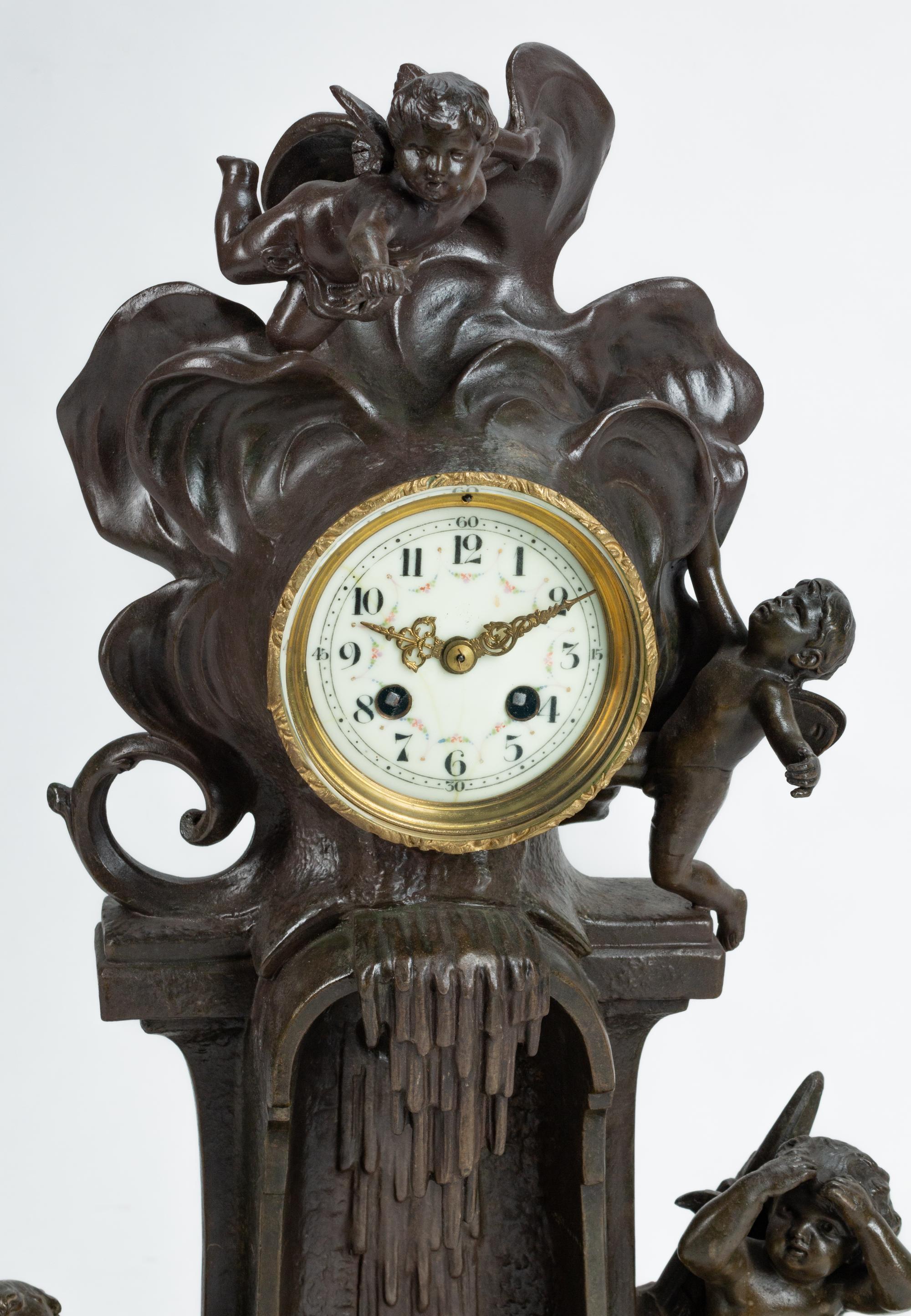 A French Patinated Bronze and Marble Mantel Clock — 19TH CENTURY