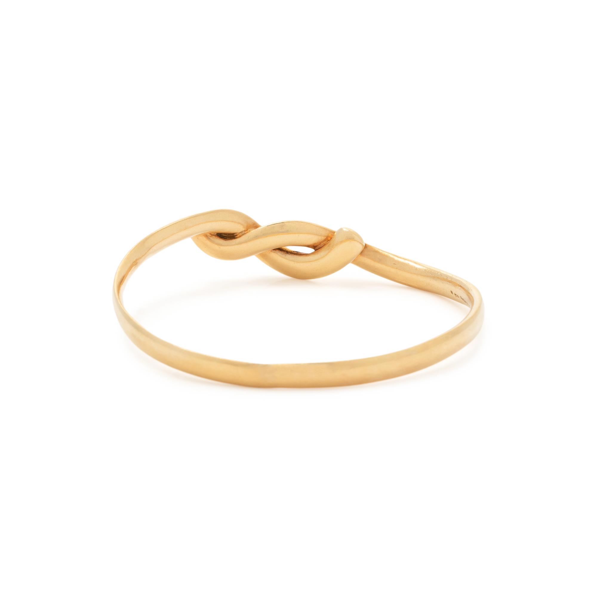TIFFANY & CO., ANGELA CUMMINGS, YELLOW GOLD BANGLE BRACELET