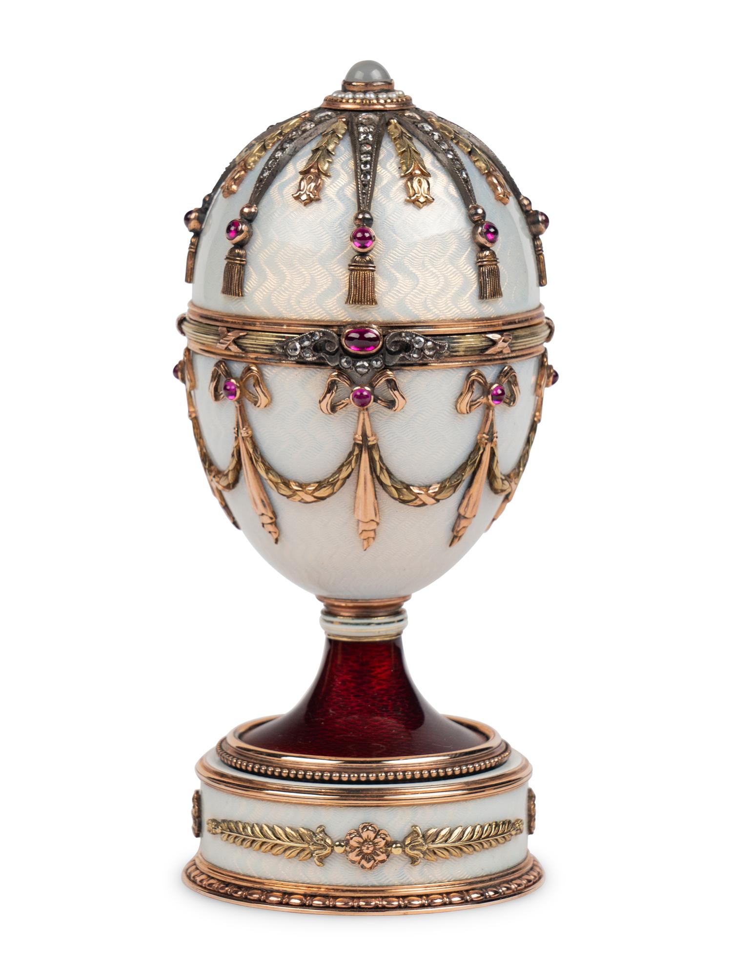 A 14 Karat Vari-Color Gold, Silver, Guilloché Enamel, Diamond, Pearl, and Cabochon Jewel-Mounted Surprise Egg