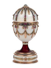 A 14 Karat Vari-Color Gold, Silver, Guilloché Enamel, Diamond, Pearl, and Cabochon Jewel-Mounted Surprise Egg