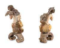 A Pair of Continental Carved, Parcel Gilt and Polychrome Painted Cherub Figures