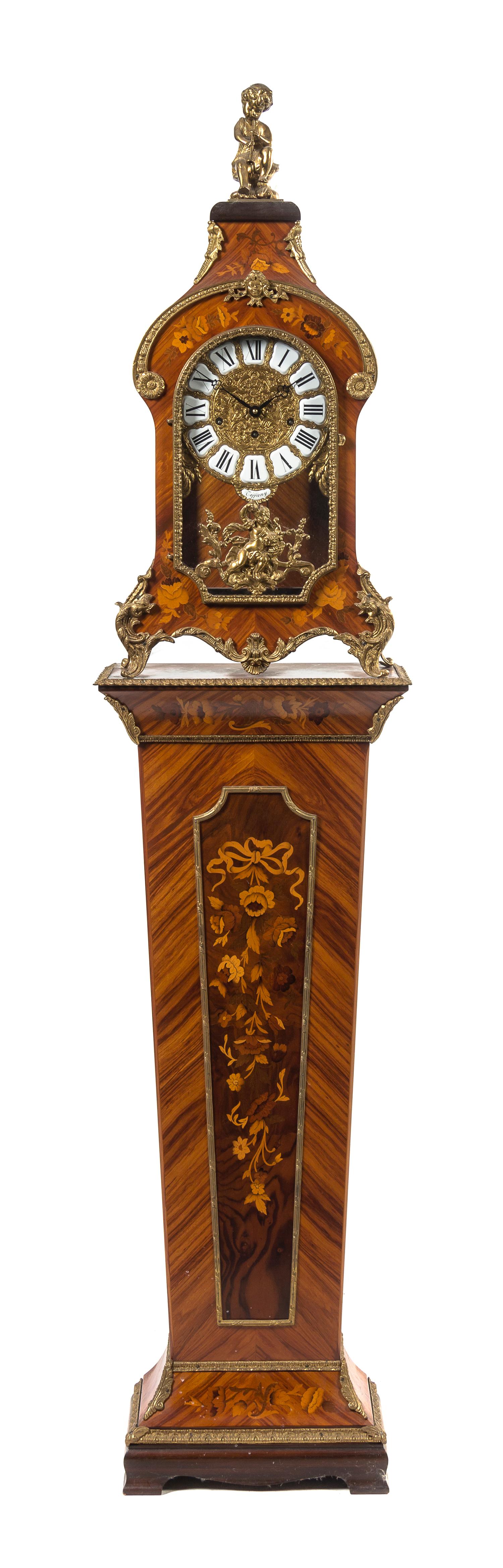 A Continental Marquetry and Gilt Metal Mounted Bracket Clock and Stand, retailed by Tiffany & Co., Height overall 75 inches.