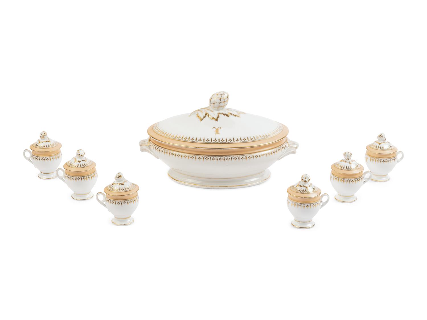 [LINCOLN, Mary Todd (1818-1882)]. A Limoges porcelain buff-ground tureen and cover together with 6 matching pots de crème with covers, purportedly purchased by Mary Todd Lincoln. France, ca. 1865.