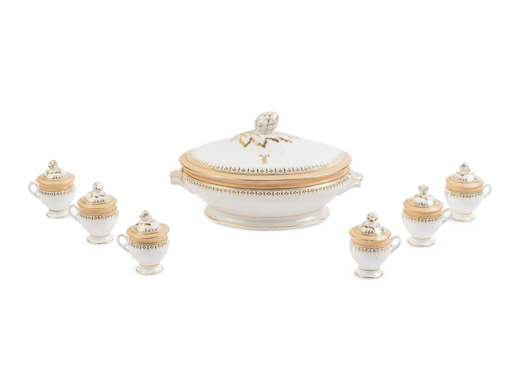 [LINCOLN, Mary Todd (1818-1882)]. A Limoges porcelain buff-ground tureen and cover together with 6 matching pots de crème with covers, purportedly purchased by Mary Todd Lincoln. France, ca. 1865.