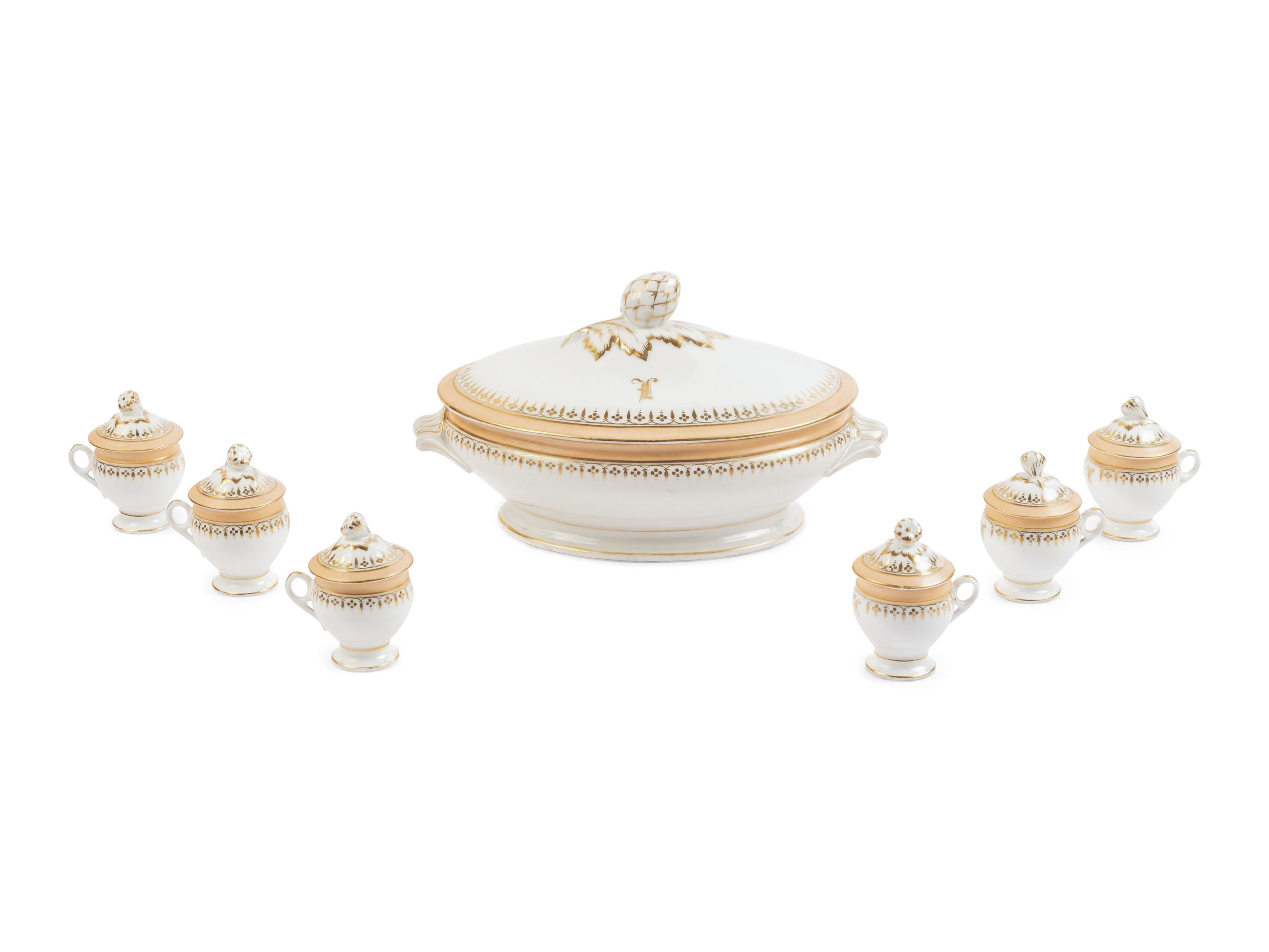 [LINCOLN, Mary Todd (1818-1882)]. A Limoges porcelain buff-ground tureen and cover together with 6 matching pots de crème with covers, purportedly purchased by Mary Todd Lincoln. France, ca. 1865.
