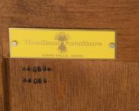 A Contemporary Carved Walnut Chest of Drawers
