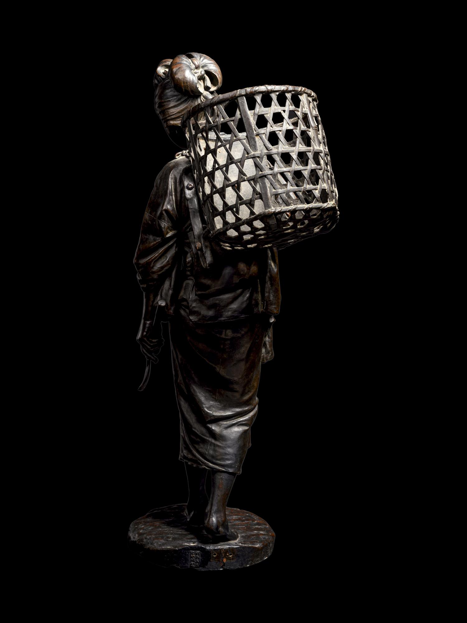 A Bronze Okimono of a Lady