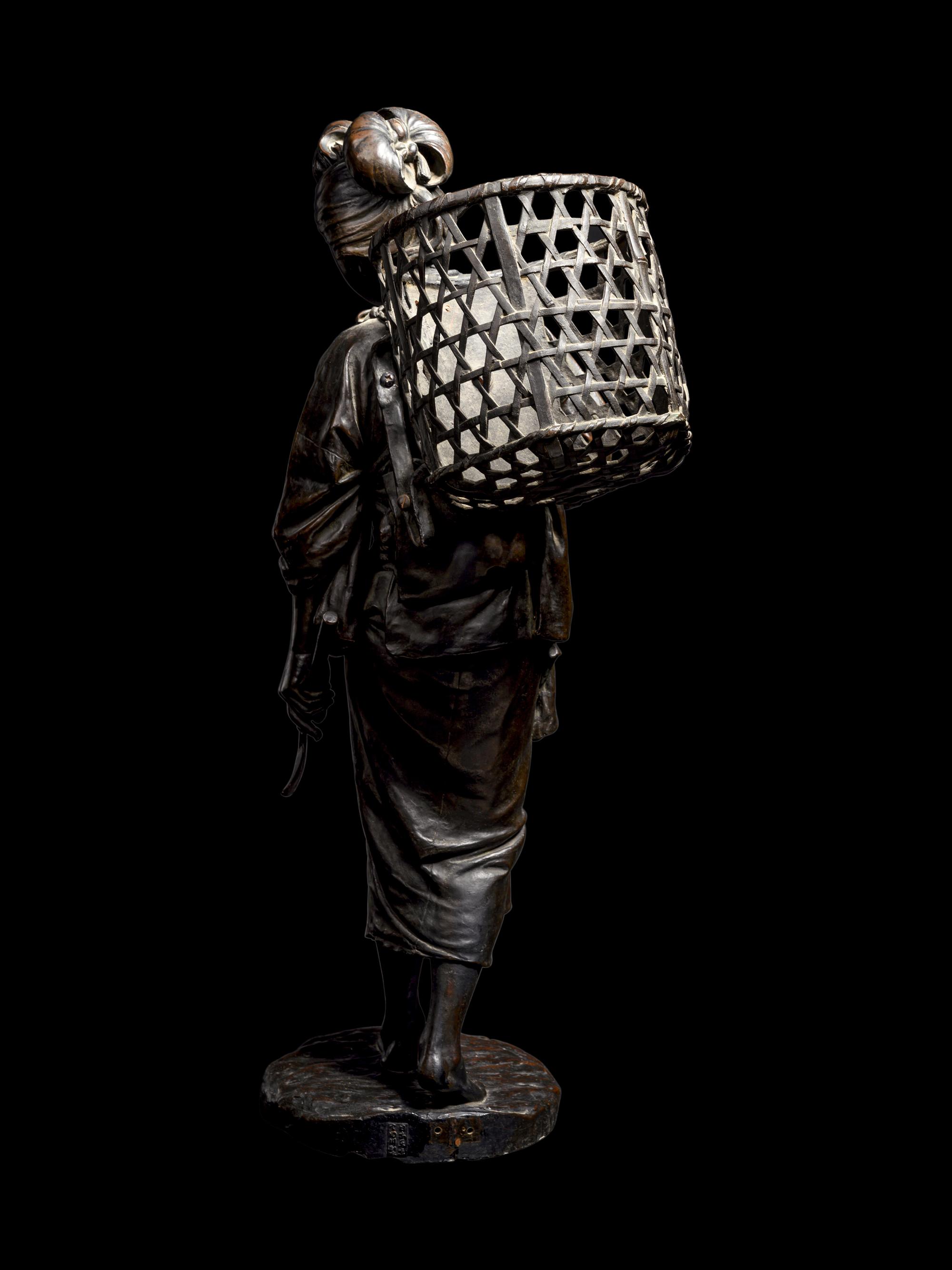 A Bronze Okimono of a Lady