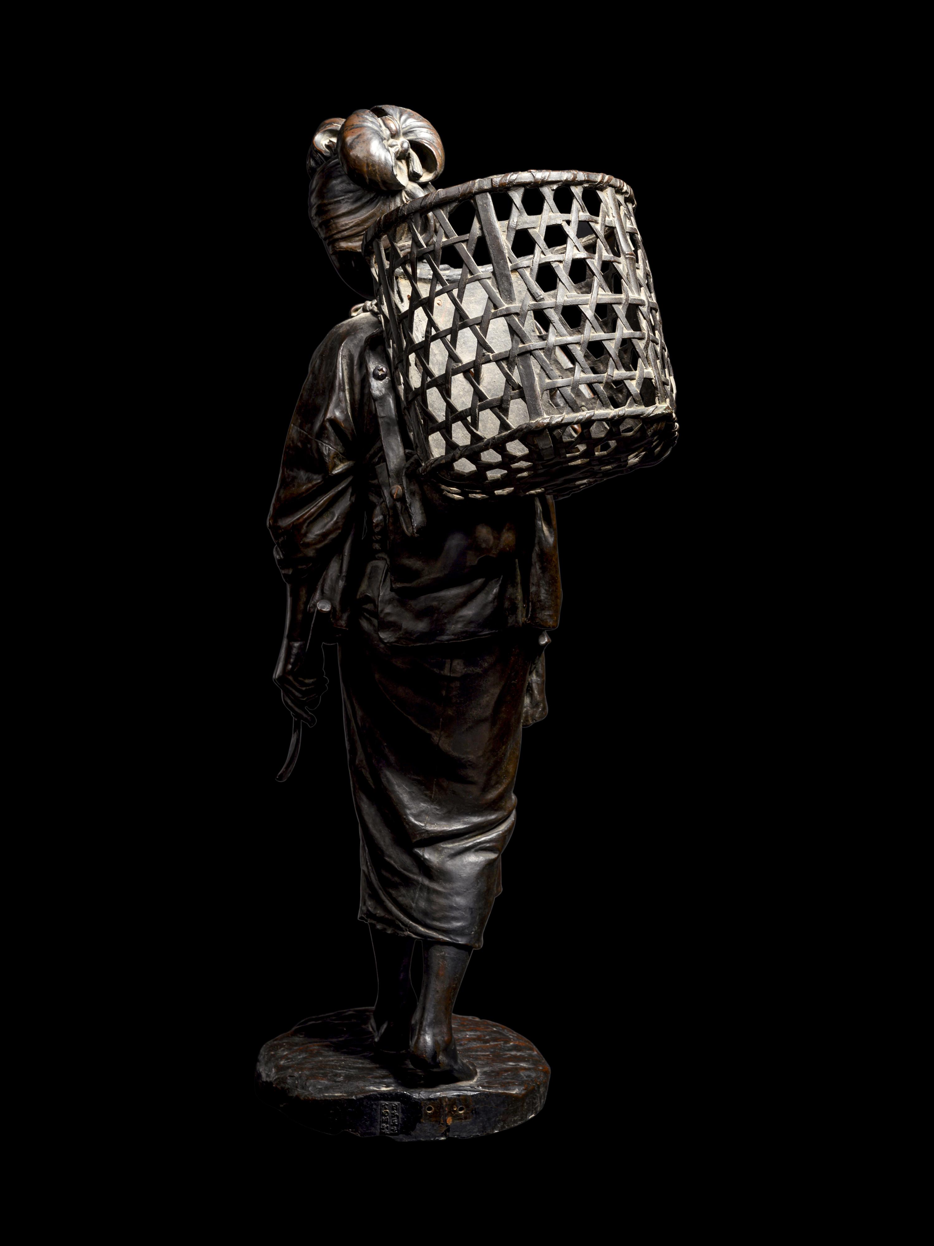 A Bronze Okimono of a Lady