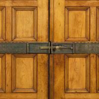A large English Aesthetic Movement oak wardrobe Attributed to Richard Norman Shaw (1831-1912) & William Eden Nesfield (1835-1888), retailed by Maple & Co. (est. 1841), London, England, circa 1870