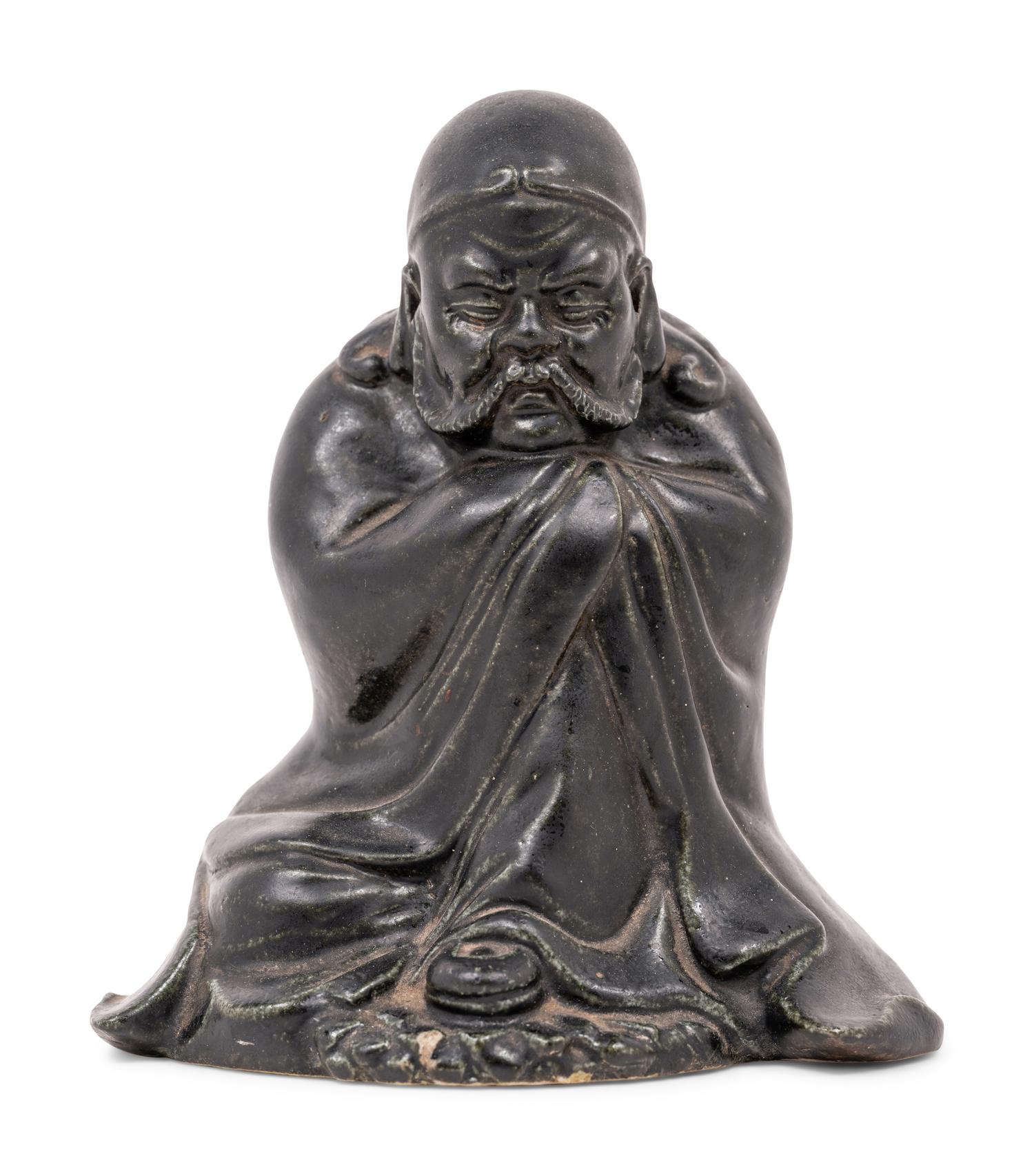 A Chinese Black Glazed Porcelain Figure of Seated Damo