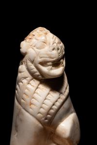 An Alabaster Seated Lion