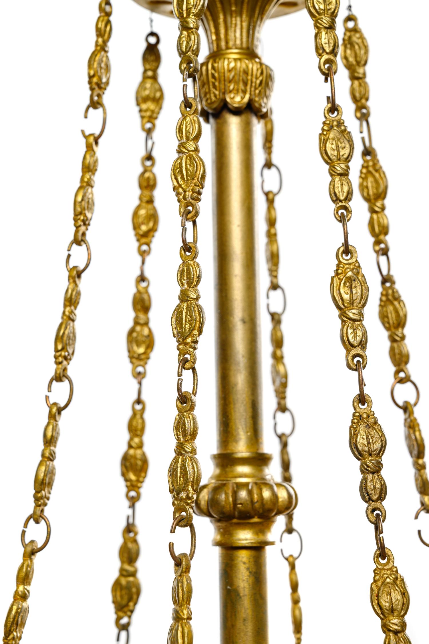 An Empire Style Gilt Bronze and Painted Tôle Six-Light Chandelier