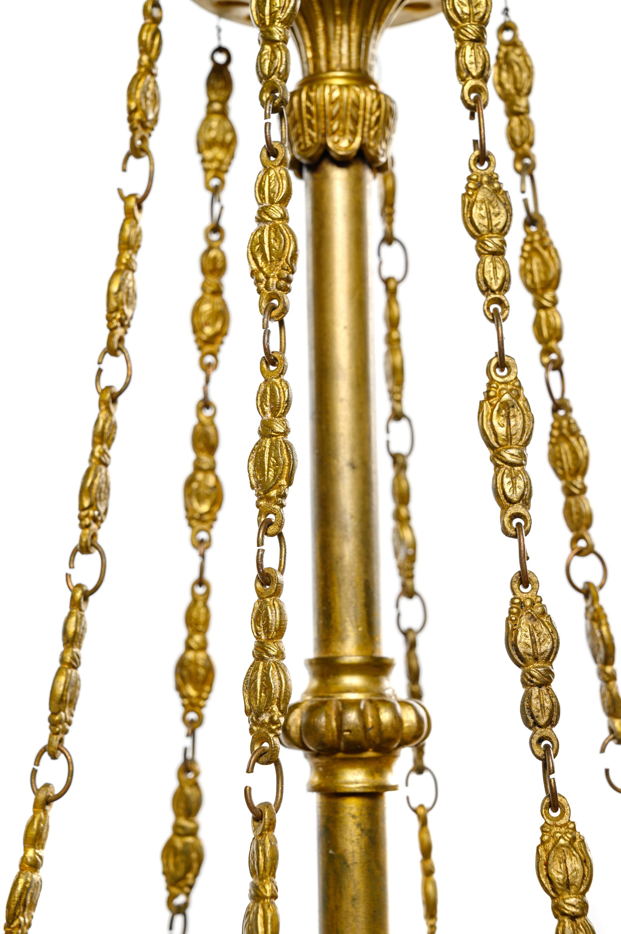 An Empire Style Gilt Bronze and Painted Tôle Six-Light Chandelier