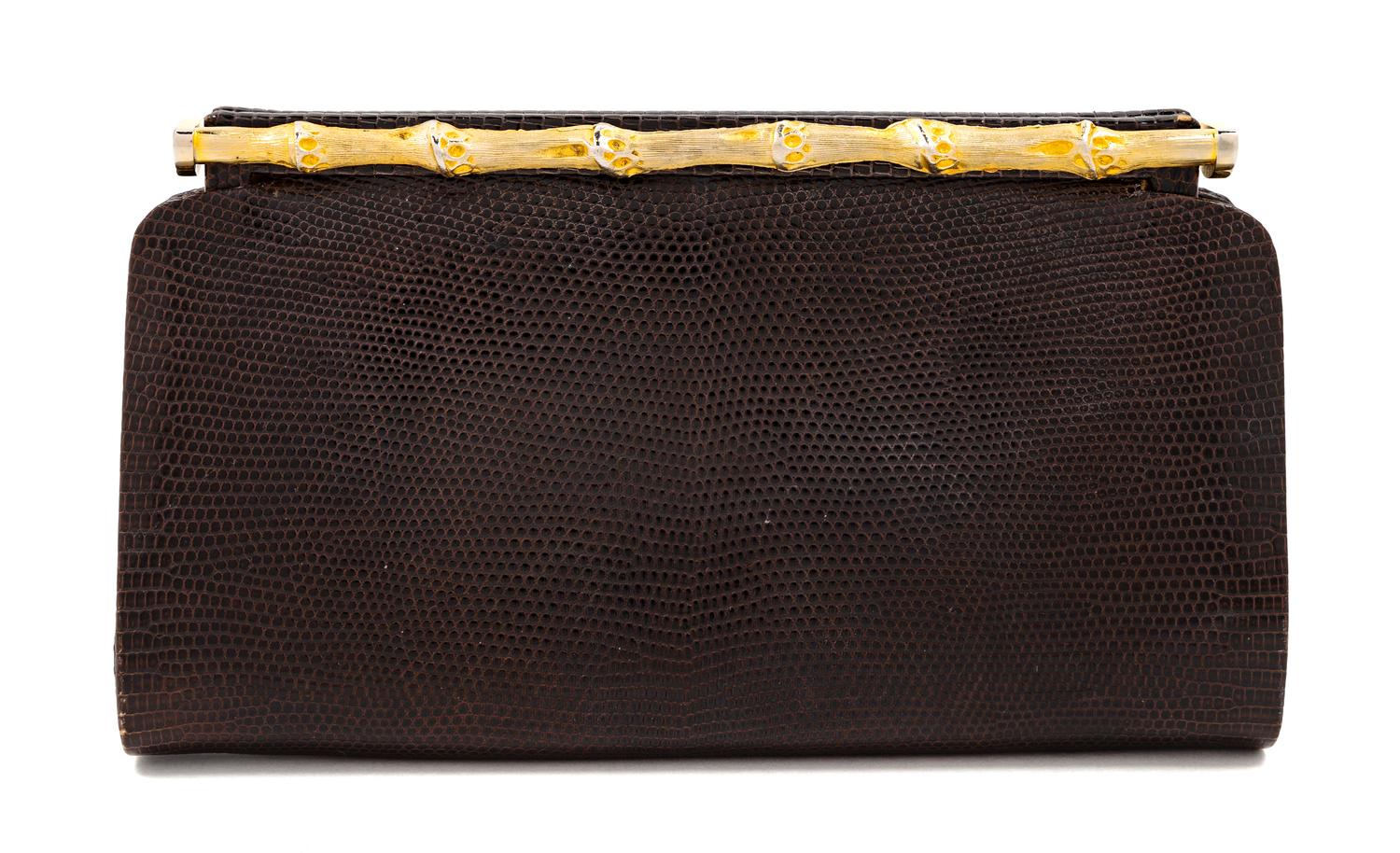 A Gucci Brown Snakeskin Clutch, 4.75" H x 8.25" W x 1.25" D.