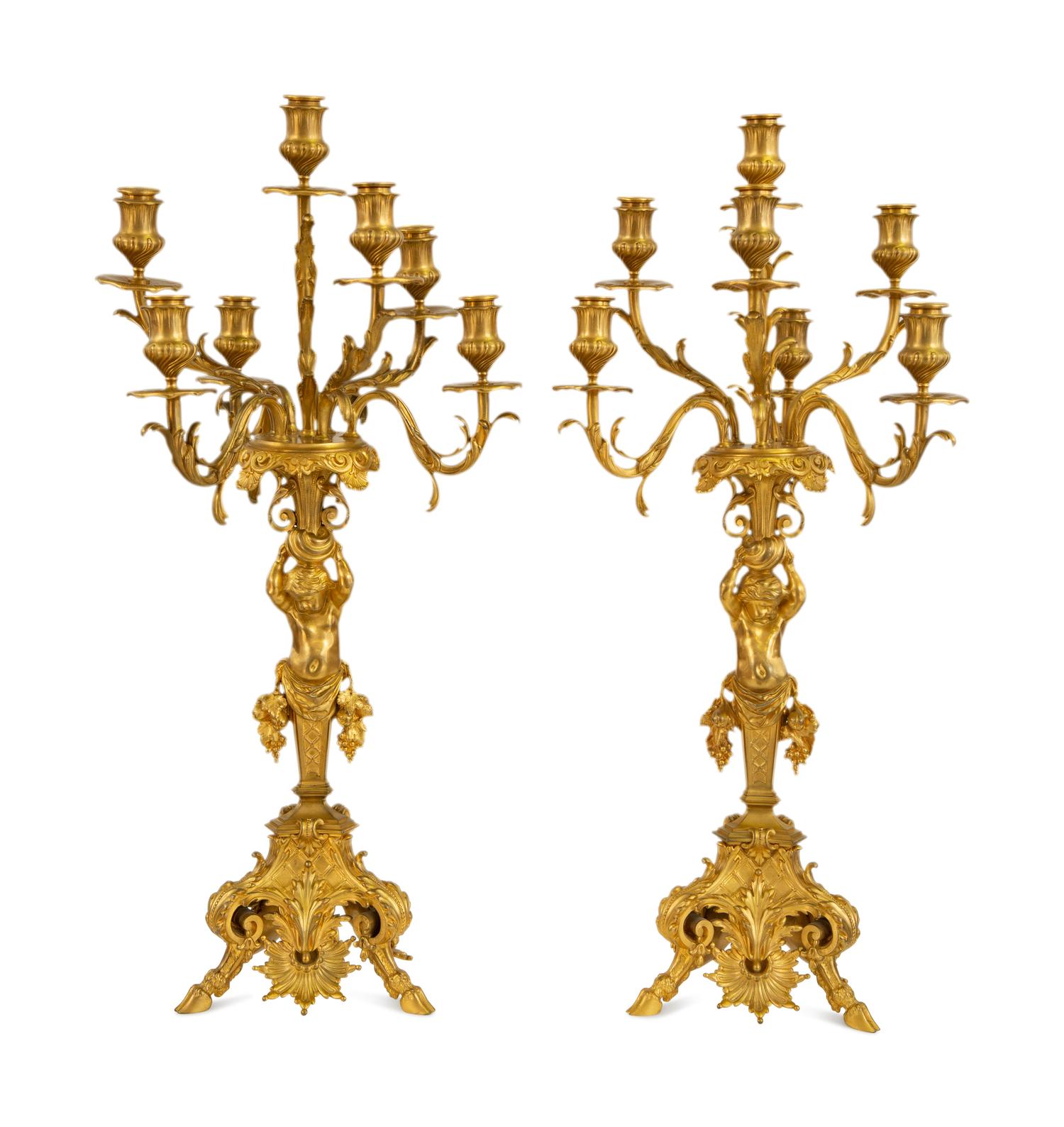 A Pair of Gilt Bronze Figural Seven-Light Candelabra