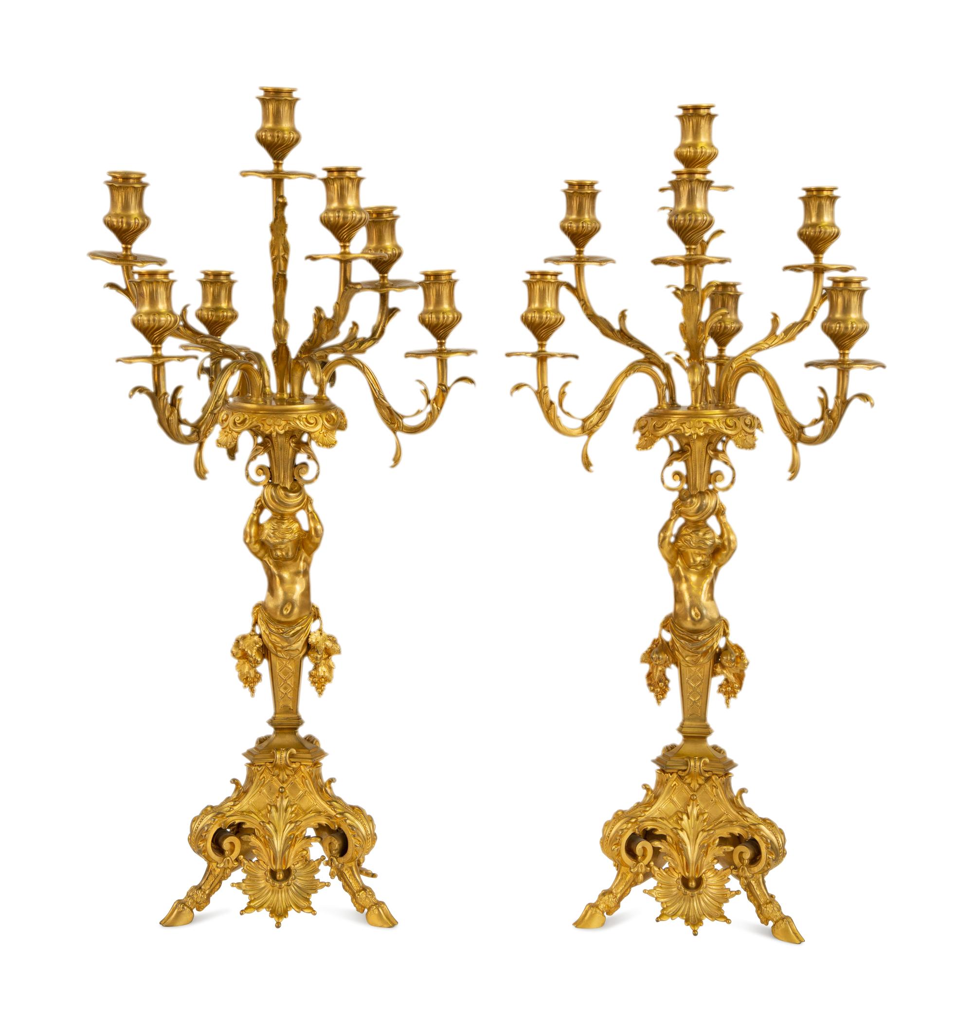 A Pair of Gilt Bronze Figural Seven-Light Candelabra